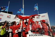 Team Penske gives Ryan Briscoe a lift after his win at Milwaukee